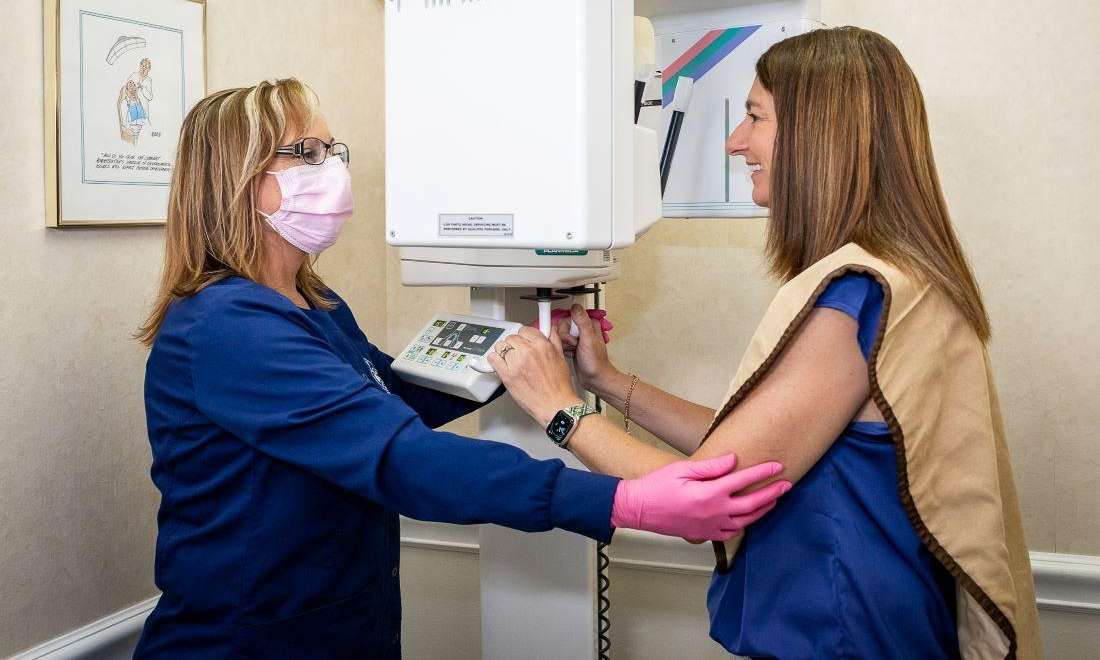Dentist in Brandon, FL using digital x-ray machine on patient